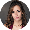 photo of a woman with brown hair and hoop earrings